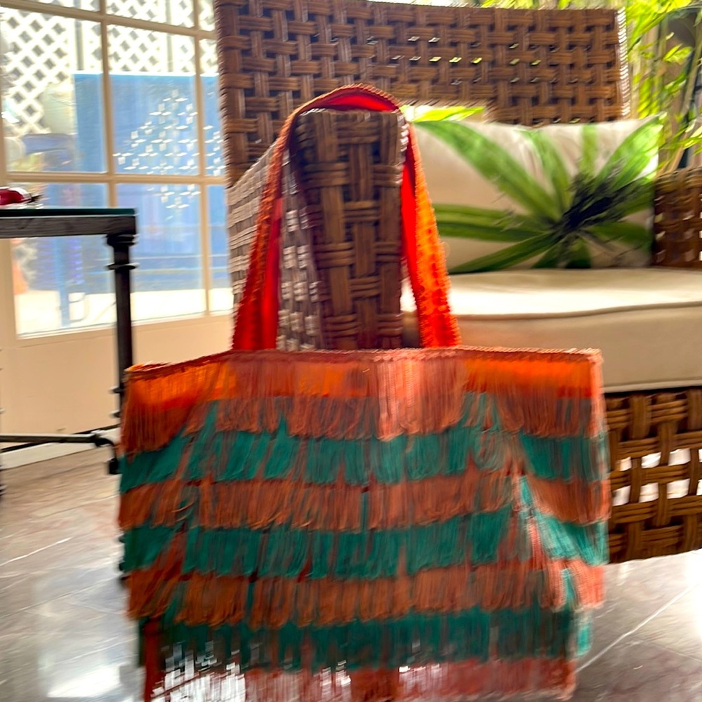 Swinging coral and turquoise fringe tote w/ snap closure